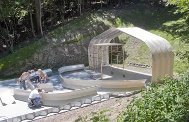 Step 2: Bolt arches together on the ground