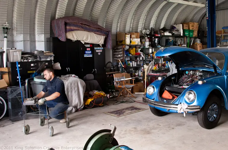 Man working on car in his workshop